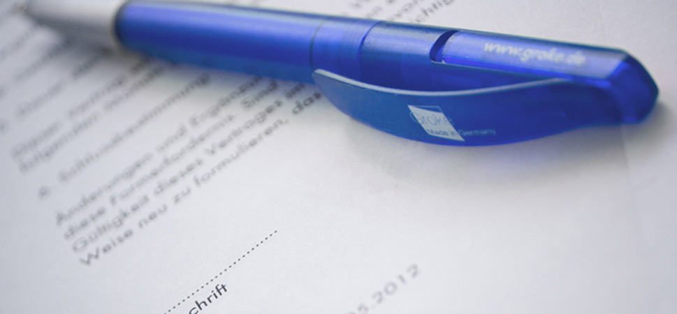 Groke Türen und Tore GmbH ballpoint pen lying on documents